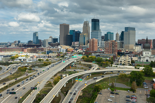 Aerial shot of Minneapolis, Minnesota on an overcast afternoon in Fall, looking over the interchange between Interstate 94 and Interstate 394 towards the Basilica of Saint Mary and downtown office towers. 

Authorization was obtained from the FAA for this operation in restricted airspace.
