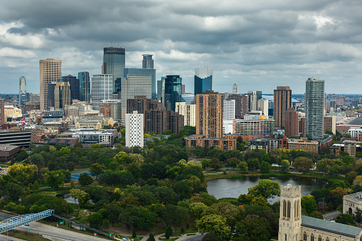 Aerial shot of Minneapolis, Minnesota on an overcast afternoon in Fall. \n\nAuthorization was obtained from the FAA for this operation in restricted airspace.
