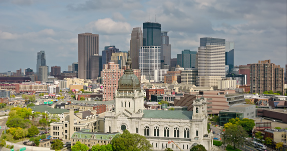 Aerial shot of Minneapolis, Minnesota on an overcast afternoon in Fall. \n\nAuthorization was obtained from the FAA for this operation in restricted airspace.