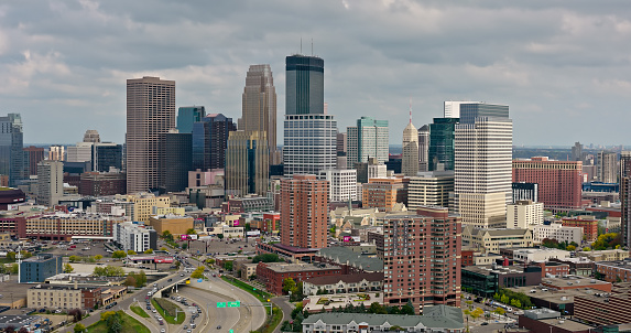 Aerial shot of Minneapolis, Minnesota on an overcast afternoon in Fall. \n\nAuthorization was obtained from the FAA for this operation in restricted airspace.