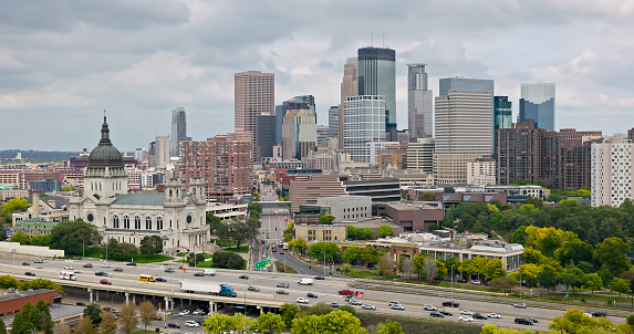 Aerial shot of Minneapolis, Minnesota on an overcast afternoon in Fall. \n\nAuthorization was obtained from the FAA for this operation in restricted airspace.