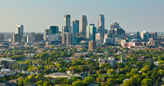 Aerial shot of Minneapolis, Minnesota on a clear evening in Fall from over residential streets in Phillips. \n\nAuthorization was obtained from the FAA for this operation in restricted airspace.