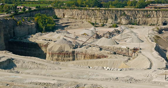 Lanark County, Canada - September 2, 2012: A pickup truck drives through Tatlock Quarry in Lanark County, Ontario. This open pit mine is the largest calcium-carbonate quarry in Canada.