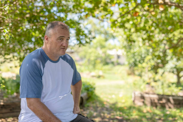 istock Middle aged man relaxing in a community garden 1836687485