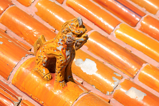 Chinese traditional style yellow glazed tile roof, closeup of photo
