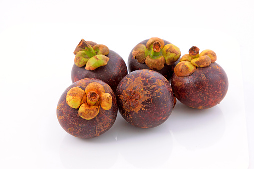 mangosteen on a white background, closeup of photo