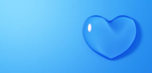 istock 3D Illustration.Transparent ice-glass heart on blue background. Copy space. (horizontal) 1836734465