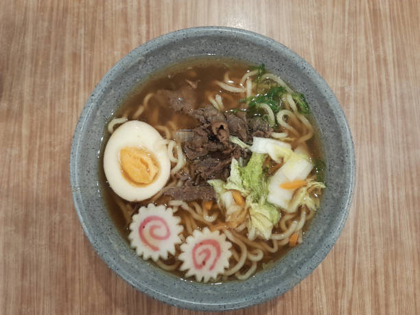 istock Bowl of beef curry ramen on wooden table. 1836750408