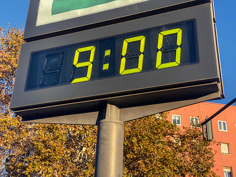 Low angle view of billboard showing 9:00 hours in the city of Valencia, Spain