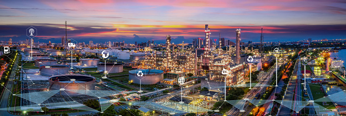 Oil and gas industry - refinery factory zone, The equipment of oil refining,Close-up of industrial pipelines of an oil-refinery petrochemical plant at sunset