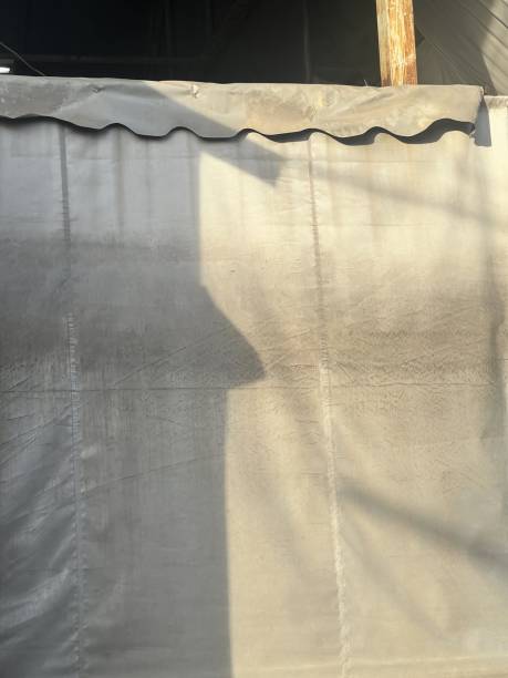 istock shadow of a curtain on a window. 1836800815