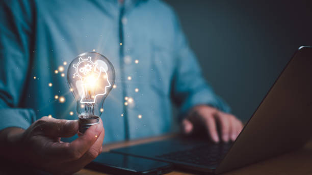istock Hand holding lightbulb with AI, Artificial intelligence. Ai digital brain. Robotics concept, innovation and technology, machine and deep learning, neural networks and another modern technologies. 1836801875