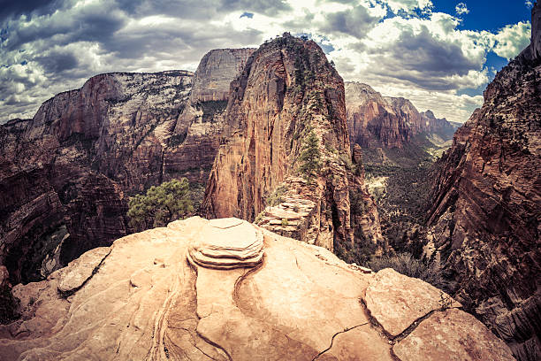 The final precarious section of the hiking trail to Angels Landing in Zion National Park, Utah. Angels Landing is at the top of the red sandstone cliffs in the centre of the picture and provides views of the whole of Zion Canyon.