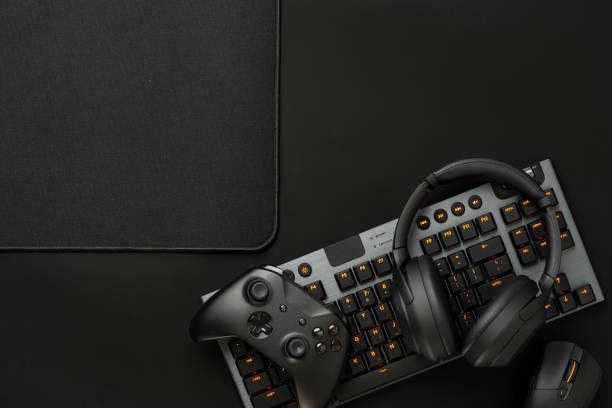 istock Gaming concept on black background with computer keyboard and joystick 1836808844