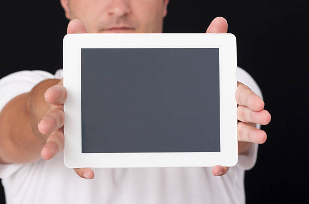 istock digital tablet front of the face 183681106