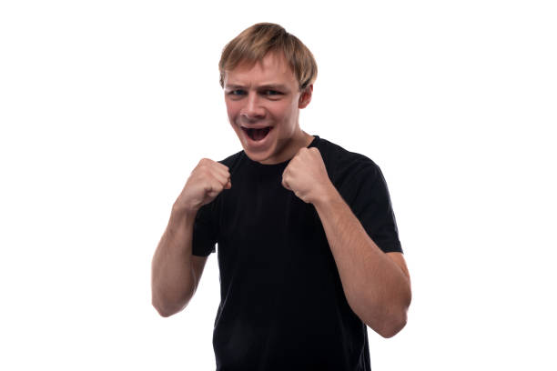 istock Joyful young man with blond hair screams with joy 1836823092