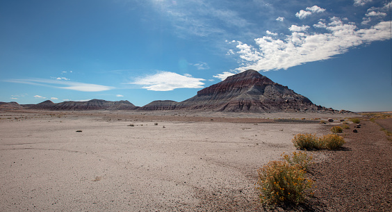 Cumulus clouds over Petrified Forest National Park desert landscape in Arizona United States