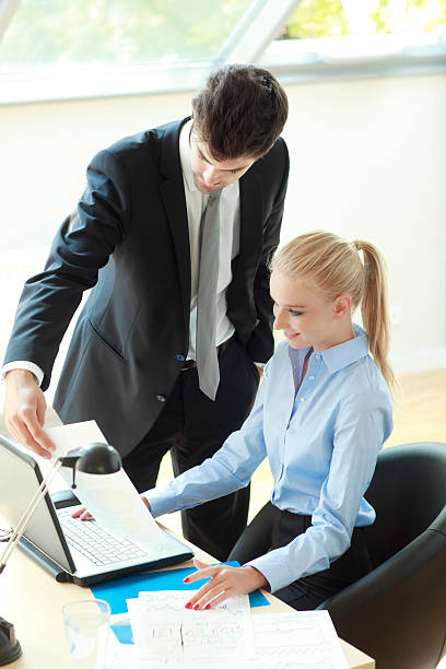 istock Businesscouple Working On Laptop 183682680