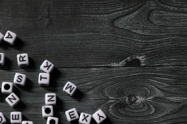 istock alphabet blocks on wooden texture background with negative space 1836844436