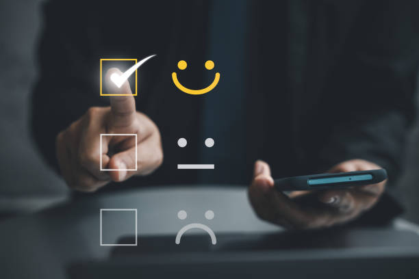 istock Man using smartphone and laptop computer to rate and evaluate services 1836860994