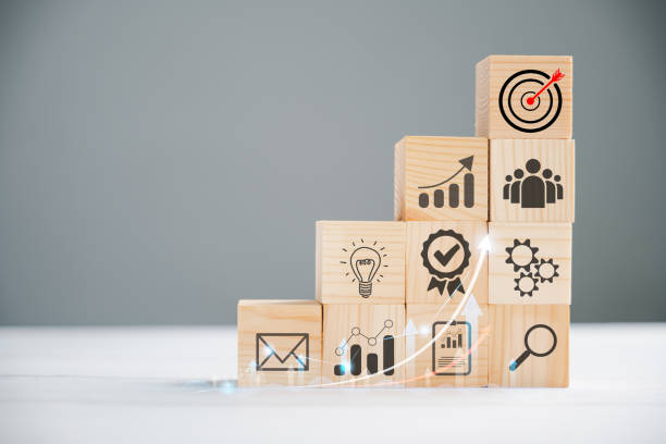 istock Wooden block cude step on table with Action Plan 1836861530