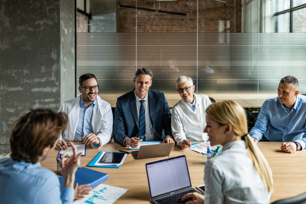 istock General practitioners and businessmen having a meeting in the office. 1836867333