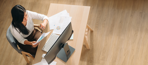 Top view of Team business woman using laptop while plan and discussion information for financial in home office. Beautiful woman happy and working at indoors.