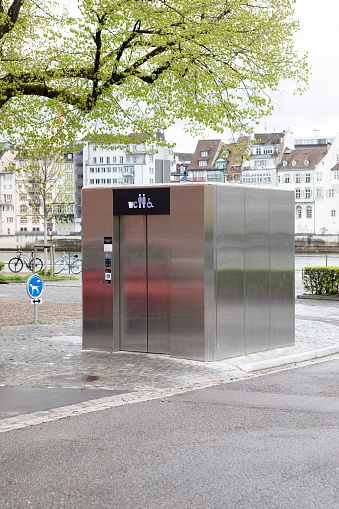 Unisex public toilet in Basel by the banks of the River Rhine