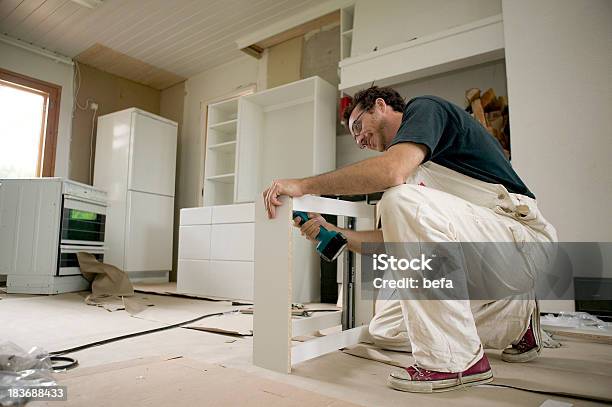 Assembling Kitchen Units Stock Photo - Download Image Now - Adult, Box - Container, Cabinet