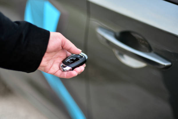 istock A woman holds a pop-up car key in her hand 1836897869
