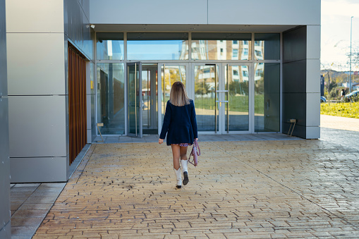Business Woman Entering Office Building