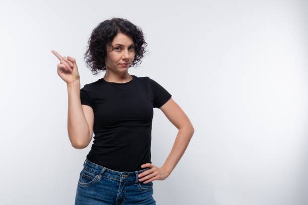 istock Cute brunette with curly hairstyle wearing a basic t-shirt 1836909876