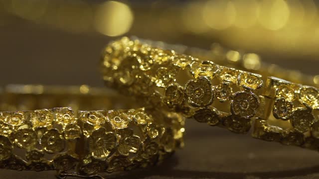 Luxury bracelet gold on a wooden table
