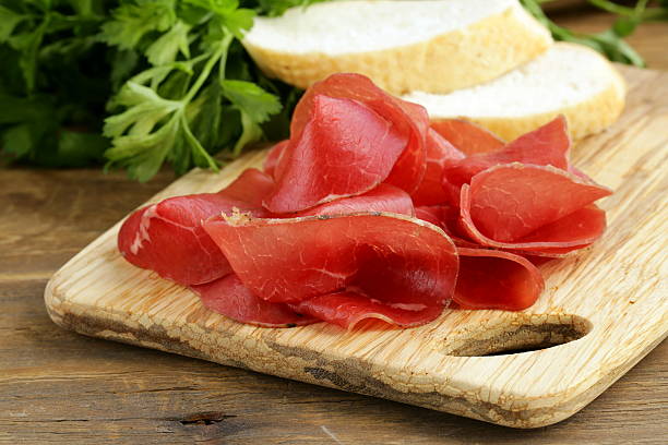 istock Smoked meat bresaola on a cutting board 183692334