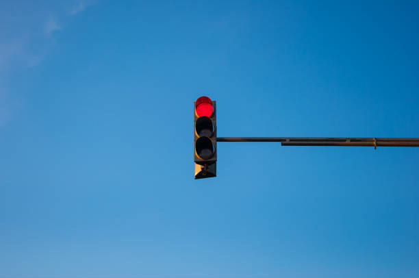 istock Traffic light showing red with blue sky background 1836935192