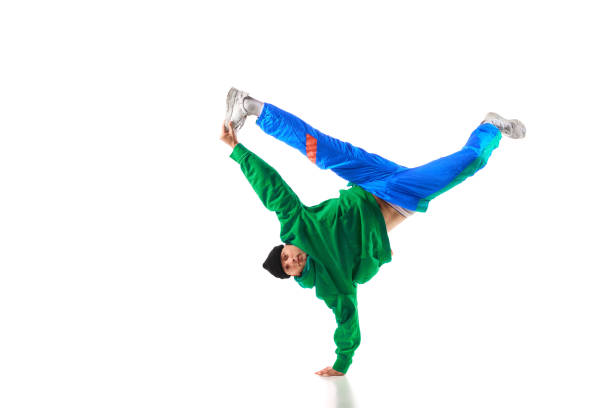 istock Young sportive man performing dance, hip-hop, breakdance elements in motion against white background. 1836939839