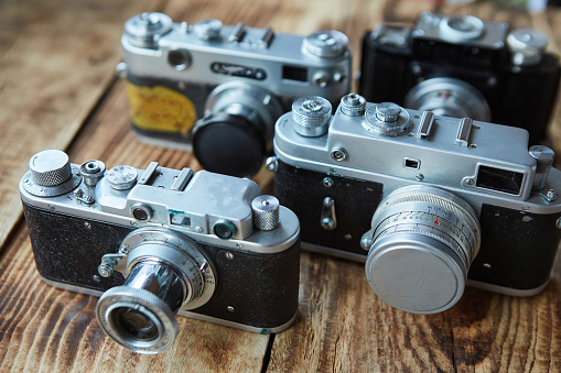 Several vintage cameras, taking pictures on film. Vintage technology for the photographer.