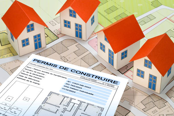 istock Building permit concept written in French - PERMIS DE CONSTRUIRE - Building activity with vacant land - Construction industry with a cadastral map, General Urban Planning and zoning regulations 1836952042