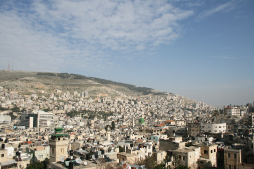Skyline of Nablus and Israeli militar base on top of the hill, Palestine. West Bank