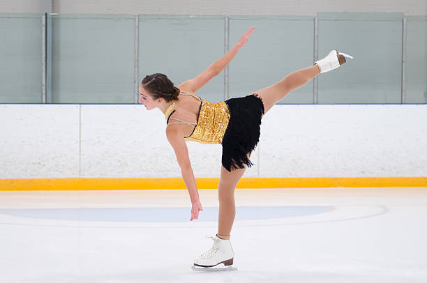 Figure skater glides on one leg