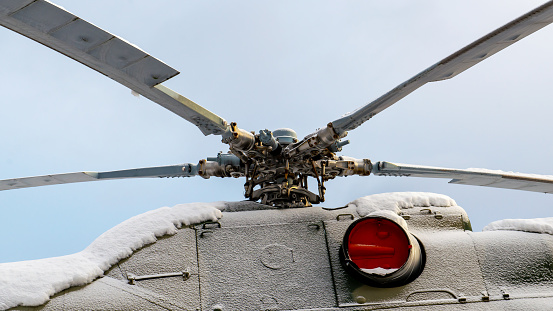 Close-up of the rotor mechanism of a helicopter in frost