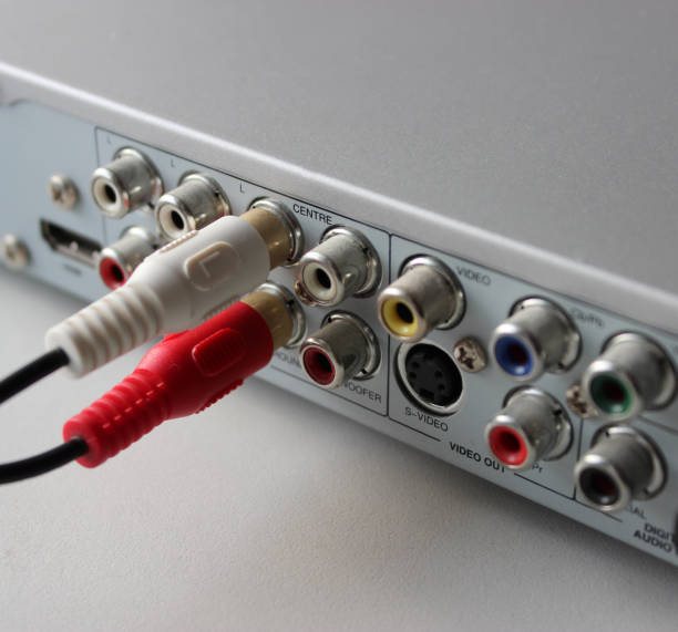 istock Two RCA plugs connected to output video slots of multimedia player rear panel 1836982710