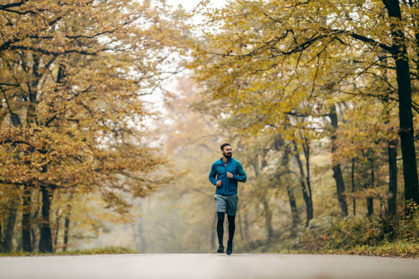 istock A fit runner running in nature. 1836984299
