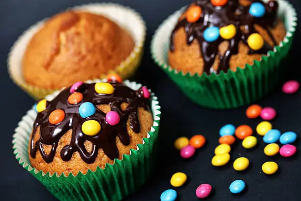 Muffin with chocolate glaze and smarties