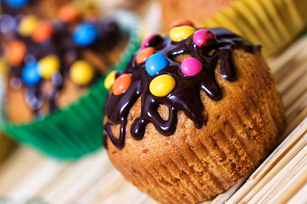 Muffin with chocolate glaze and smarties