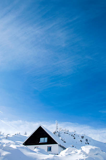 Cottage house  in the mountains, winter scene.