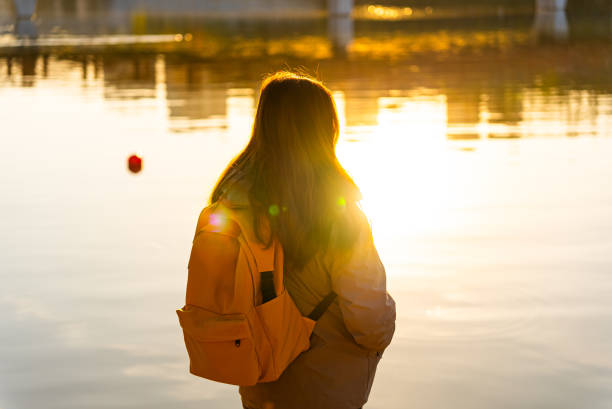 Women travel and looking lake sunset