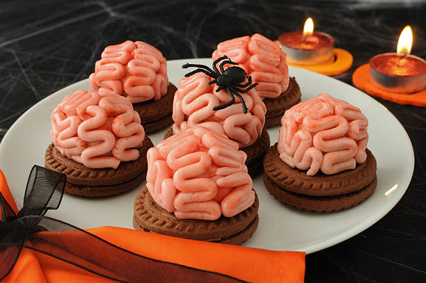 Cookies for Halloween Funny cookie with brains of marzipan on Halloween animal brain stock pictures, royalty-free photos & images