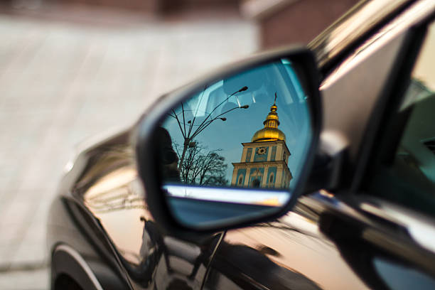 Reflection of the Orthodox Church in a car mirror. stock photo