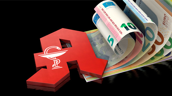 Symbolic image: German pharmacy sign on Euro bills